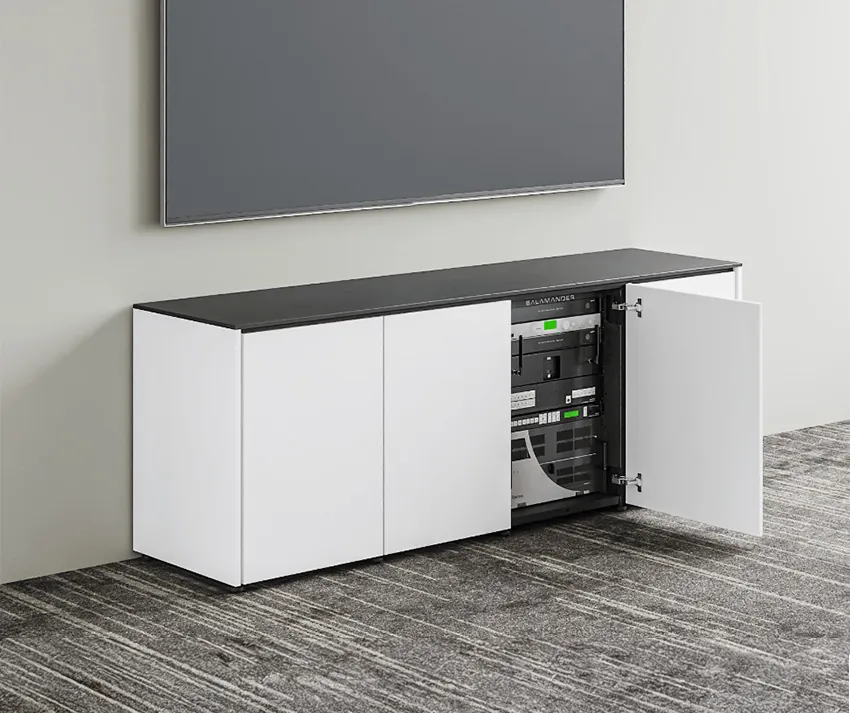 A white low cabinet under a wall display with its doors open to show equipment